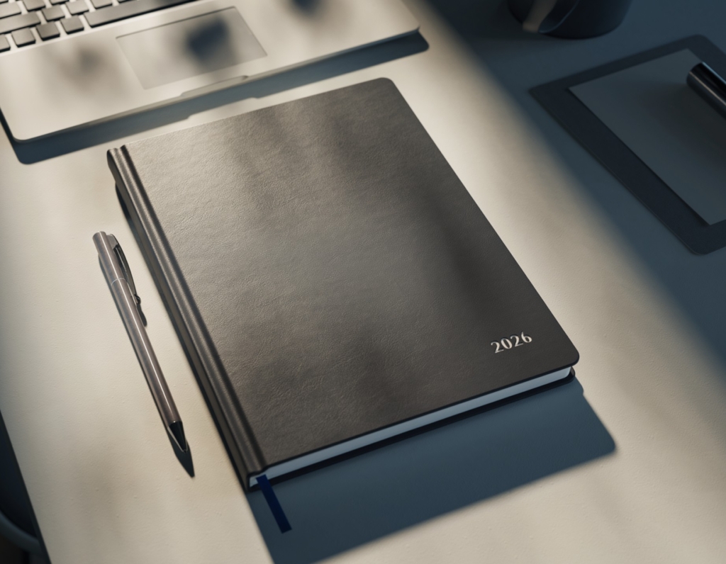 pvc cover diary with pen on table